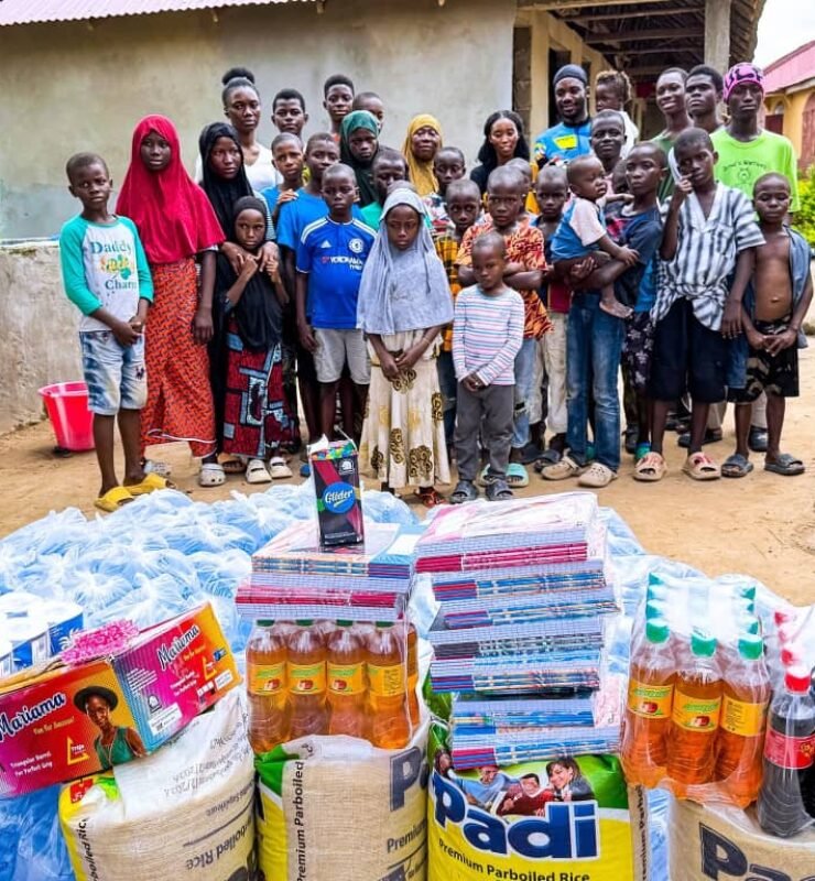 Emmiwuks interacting with orphaned children during his charity cycling mission aimed at supporting vulnerable African youth