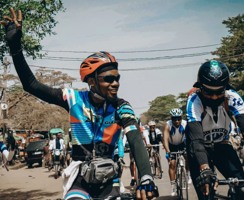 Emmiwuks advocating for children’s welfare while traveling by bicycle across Africa